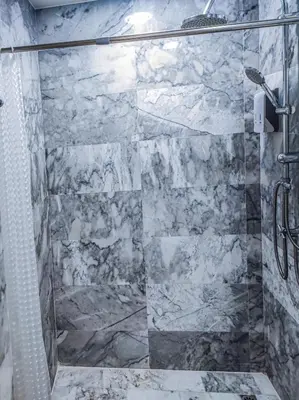 a shower with a glass door in a bathroom at MBC Mai Khao Beach Condotel LUXURY APARTMENTs in Phuket Town