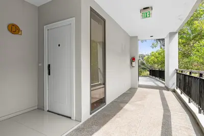 an empty hallway of a house with a door at Icon Park Apartments - Kamala Beach in Kamala Beach