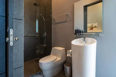 a bathroom with a toilet and a shower and a sink at La Belle Pool Villa Phuket - Home Away from HOME in Bang Tao Beach