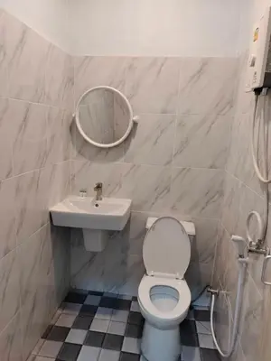 a bathroom with a toilet and a sink at Baan seefa homestay kohyaoyai in Ko Yao Yai
