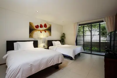 a bedroom with two beds and a large window at The heights B18 Seaview near Kata Beach in Kata Beach