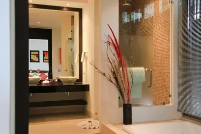 a bathroom with a tub and a sink and a mirror at Kata gardens luxury 2bedroom 4B Near Kata Noi Beach in Kata Beach