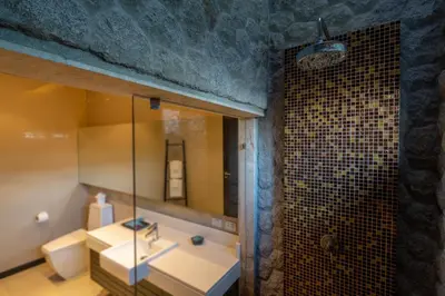 a bathroom with a sink and a mirror at The Harmony Pool Villa Phuket in Bang Tao Beach
