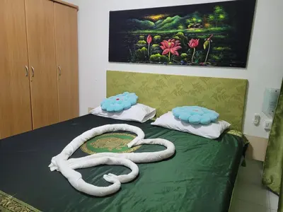 a bed with two oxygen tubes on top of it at B&B NAMO PHUKET in Kathu