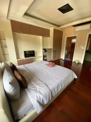 a bedroom with a large white bed with pillows at Phuket Pool Villa Sea view at town in Phuket Town