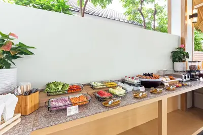 a buffet of food sitting on a counter at Lady Naya Villas - SHA Extra Plus in Rawai Beach