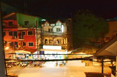 a view of a city at night at Baan Veerakit Hotel in Patong Beach