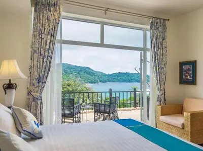 a bedroom with a bed and a balcony with a view at Katamanda - Villa Amanzi by Elite Havens in Kata Beach