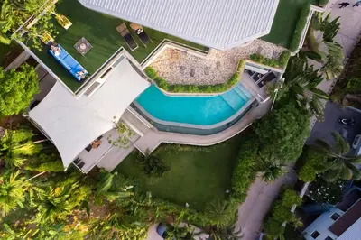 an overhead view of a pool and a house at Villa Beyond 9 Bedrooms Seaview - Full Services in Bang Tao Beach