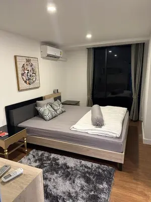 a bedroom with a large bed in a room at Unique loft 2-BR near of Surin Beach, private patio in Surin Beach