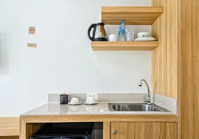 a kitchen with a sink and a counter at The Beach at Klong Muang in Klong Muang Beach