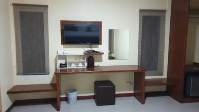 a room with a desk with a flat screen tv at ฺBankunyaiy Resort in Ko Yao Yai