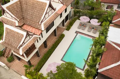 an aerial view of a house with a swimming pool at Sabai Villa Kata by RESAVA in Kata Beach