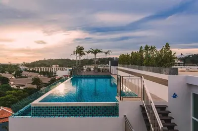 a swimming pool on the side of a building at Ozone Kata -Great location, rooftop pool, convenient studio in Karon Beach