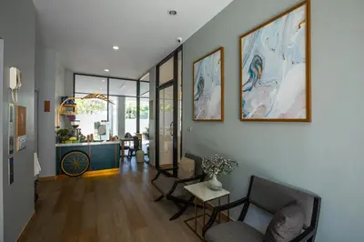 a living room with a couch and a table at Palmetto Condominium in Karon Beach