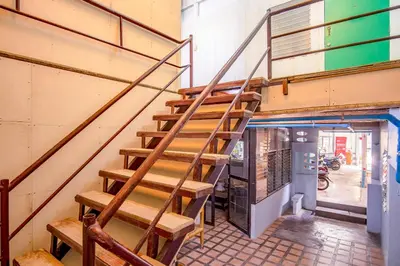 a staircase leading up to a building with a building at Baan Kim Lian SHA in Phuket Town