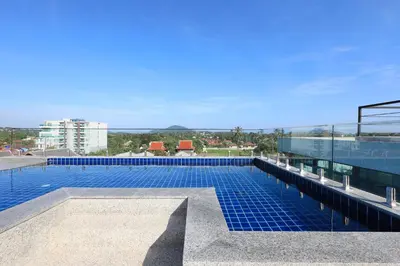 a swimming pool on the roof of a building at Relife Windy by Holy Cow, studio with sofa-bed in Rawai Beach