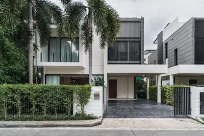 a house with palm trees in front of it at 5bdr Pool Villa In Laguna Park #46 By Capital Pro in Bang Tao Beach
