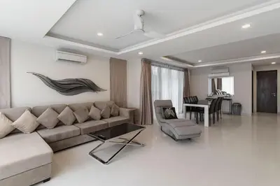 a living room with a couch and a table at 5bdr Pool Villa In Laguna Park #46 By Capital Pro in Bang Tao Beach