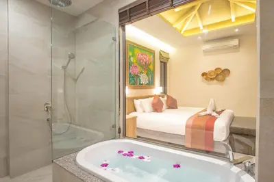 a bathroom with a tub and a bed and a shower at Boutique 2BR Pool Villa Dalaa 1, Gated Residence, Kamala Beach in Kamala Beach