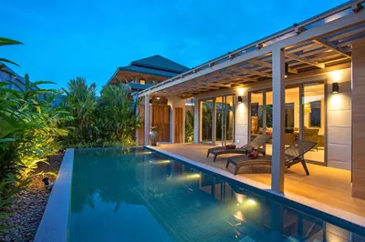 a villa with a swimming pool at night at Boutique Resort 2BR Pool Villa Dalaa 2, Kamala Beach in Kamala Beach
