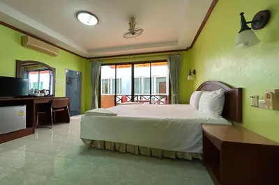 a bedroom with a large bed and a balcony at Me Mee Place & Tour Krabi in Ao Nang Beach