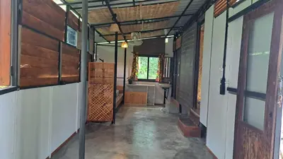 a hallway of a house with a room with a sink at Big Hug Home in Ko Yao Noi