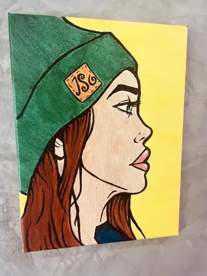a drawing of a woman wearing a green cap at Destination39 in Thalang