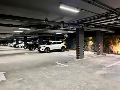 a parking lot with a bunch of cars parked in it at Aristo Resort Surin Beach K5 in Phuket Town