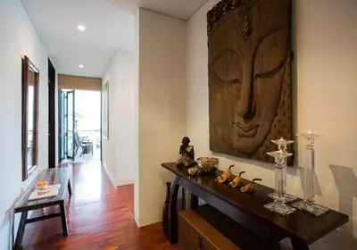 a living room with a table and a painting on the wall at Kata gardens 2 bedroom near Kata beach 3B in Kata Beach