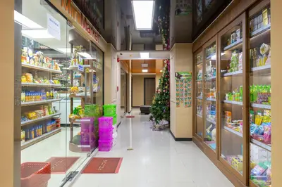a store aisle with a christmas tree in a store at NaiHarn Pearl Condo - Pets Friendly! in Nai Harn Beach