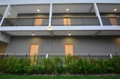 an external view of a building with a balcony at The Grey House Palai Phuket in Chalong