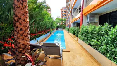 a swimming pool in the middle of a building at Naiharn Pearl Condo Hotel by VillaCarte in Nai Harn Beach
