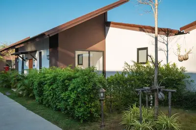 a house with a street light in front of it at Thames Tara Private Pool Villa Rawai Phuket in Rawai Beach