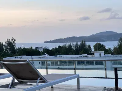 a chair sitting on top of a swimming pool at Aristo Resort Surin Beach S03 in Surin Beach