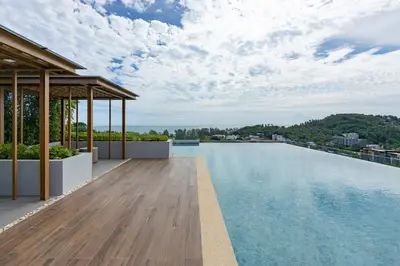 a swimming pool on the roof of a building at Sea View 1-BR 36 m2 Panora Surin by Holy Cow in Surin Beach