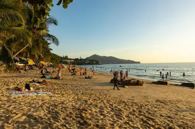 a group of people on a beach with the ocean at Sea View 1-BR 36 m2 Panora Surin by Holy Cow in Surin Beach