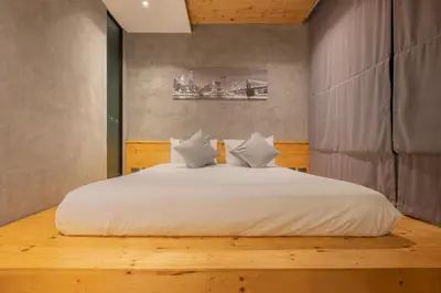 a bedroom with a large bed with white sheets and pillows at Relife Windy by Holy Cow, studio with stunning country view in Nai Harn Beach