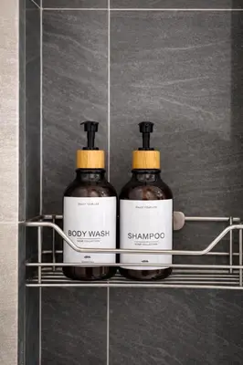 two bottles of soap on a shelf in a bathroom at Phi Phi Chang Grand Resort in Phi Phi Don