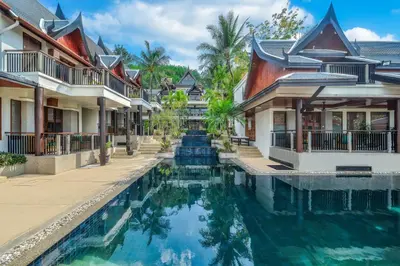 a villa with a swimming pool in a resort at Baan Yin Dee Boutique Resort Phuket - SHA Plus in Patong Beach