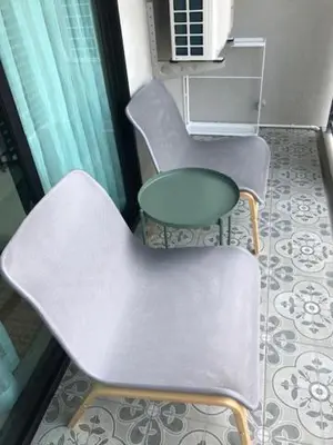 two chairs and a table in a room at Title Residence Naiyang Beach Phuket in Nai Yang Beach