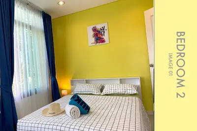 a bedroom with a bed with two hats on it at Stylish Condo w. Pool View 2F in Kamala Beach