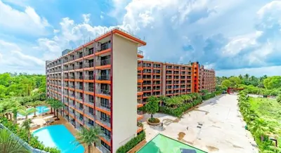 an aerial view of a hotel with a swimming pool at Mai Khao Beach Condo by VillaCarte in Mai Khao Beach