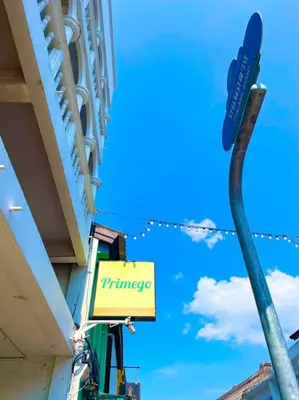 a sign for the entrance to a pharmacy at Primego Boutique Hotel in Phuket Town