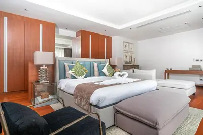 a bedroom with a large bed in a room at Botanica Bangtao Beach Villa in Phuket Town