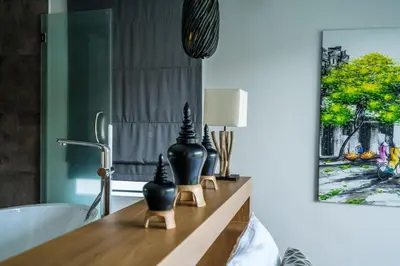 a bathroom with a counter with vases on it at Cocoon Villa - Peaceful private pool villa in north Phuket in Phuket Town