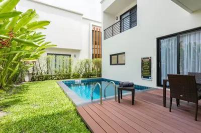 a swimming pool in the backyard of a house at Hideaway Lake Villas By Cozy Lake in Bang Tao Beach