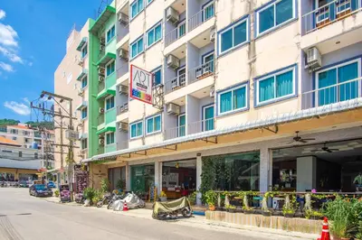 a building on the side of a street at Art Mansion Patong Hotel in Patong Beach