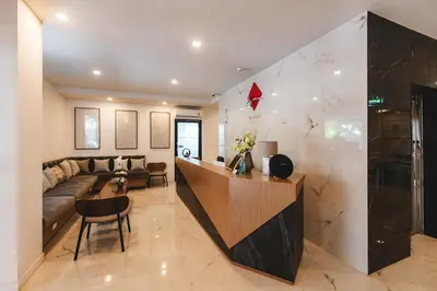 a living room with a couch and a table at The Proud Rawai Resort in Rawai Beach