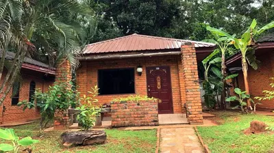 a brick house with a door in a yard at Doo Dee Boutique Resort by Swiss Chalet in Ao Nang Beach